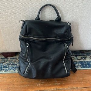 Black vegan leather backpack with silver zippers
